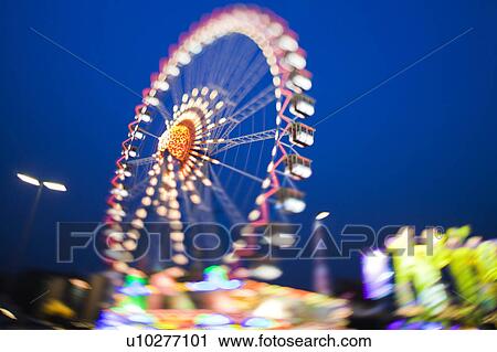Ferris wheel lit up against night sky View Large Photo Image Stock Image - Ferris wheel lit up against night sky. Fotosearch