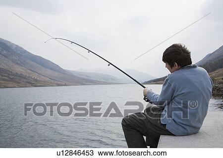 Stock Image - Fishing on the loch. Fotosearch
