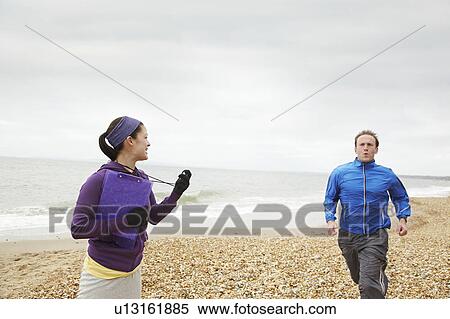 Fitness instructor timing man running View Large Photo Image Stock Photography - Fitness instructor timing man running. Fotosearch