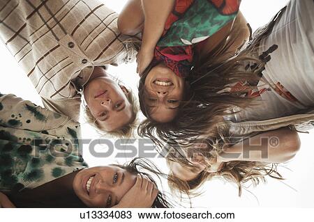Four Friends smiling View Large Photo Image Stock Image - Four Friends smiling. Fotosearch