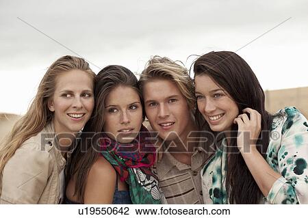 Four Friends smiling View Large Photo Image Stock Image - Four Friends smiling. Fotosearch