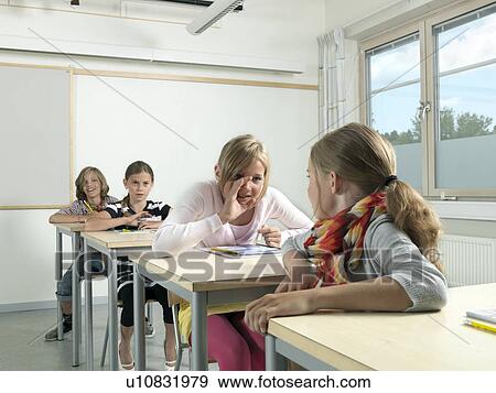 Four students in a classroom View Large Photo Image Stock Photo - Four students in a classroom. Fotosearch