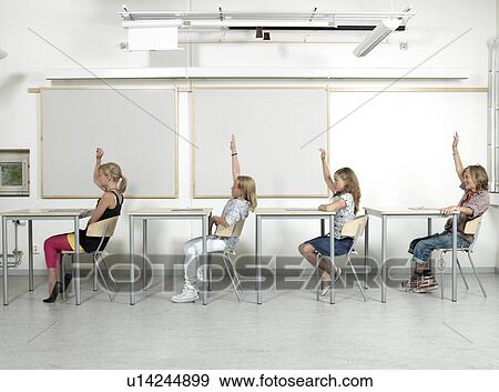 Four students in a classroom View Large Photo Image Stock Photo - Four students in a classroom. Fotosearch