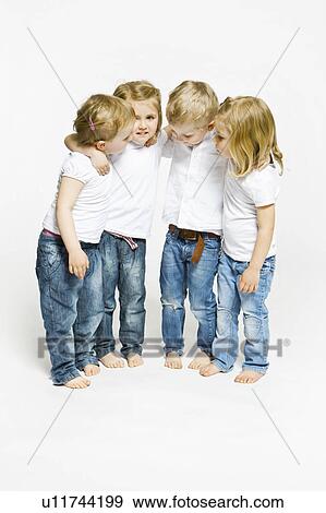 Four toddlers hugging View Large Photo Image Stock Photo - Four toddlers hugging. Fotosearch