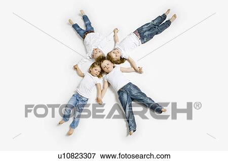 Stock Photo - Four toddlers laying in formation. Fotosearch