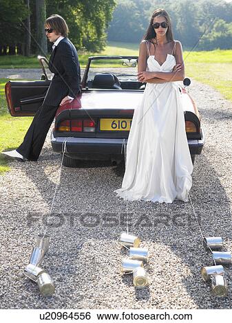 Freshly married couple wich's car broke View Large Photo Image Stock Photograph - Freshly married couple wich's car broke. Fotosearch