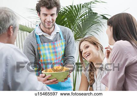 Friends have lunch with spaghetti View Large Photo Image Stock Photo - Friends have lunch with spaghetti. Fotosearch