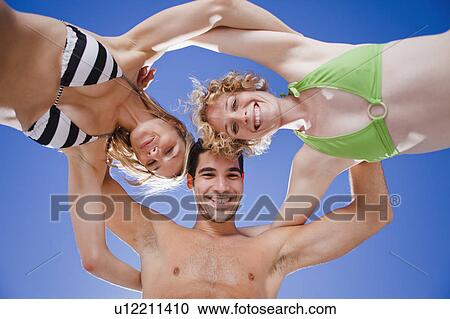 Friends hugging in a circle View Large Photo Image Stock Image - Friends hugging in a circle. Fotosearch