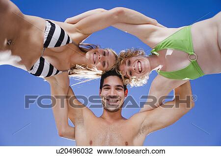 Friends hugging in a circle View Large Photo Image Stock Image - Friends hugging in a circle. Fotosearch