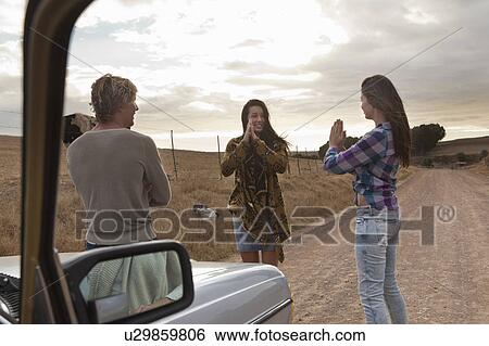 Stock Photograph - Friends playing. Fotosearch