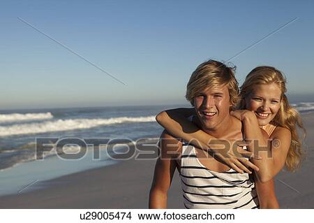 Picture - Girl and Boy on Beach. Fotosearch