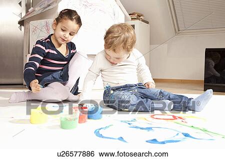 Girl and boy playing with finger paint View Large Photo Image Stock Photograph - Girl and boy playing with finger paint. Fotosearch