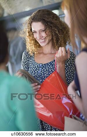 Girl friends on shopping tour View Large Photo Image Stock Photograph - Girl friends on shopping tour. Fotosearch