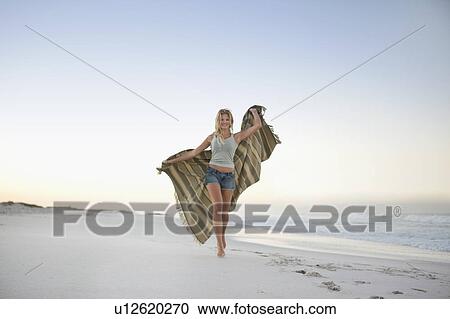 Girl going on beach View Large Photo Image Stock Image - Girl going on beach. Fotosearch
