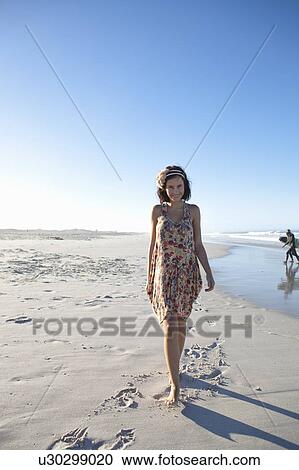 Girl going on beach View Large Photo Image Stock Image - Girl going on beach. Fotosearch