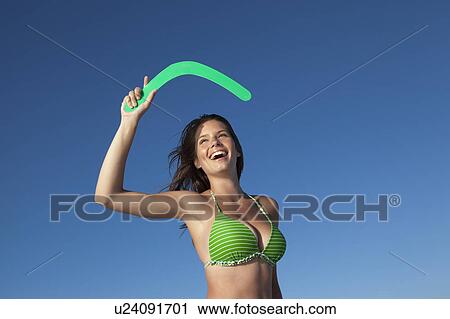 Girl holding boomerang View Large Photo Image Stock Image - Girl holding boomerang. Fotosearch