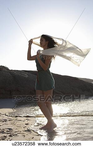 Girl holding scarf View Large Photo Image Stock Photo - Girl holding scarf. Fotosearch