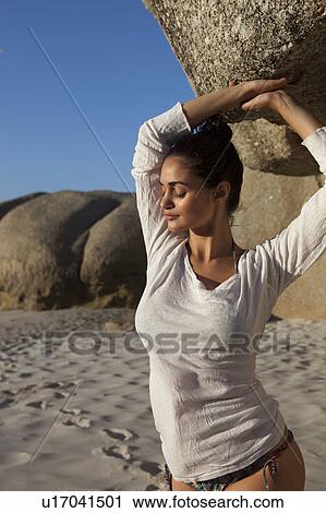 Stock Image - Girl holding stone. Fotosearch