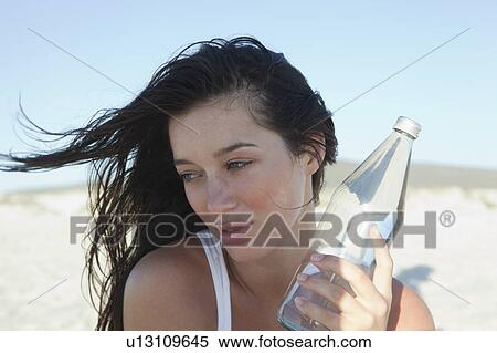 Stock Photography - Girl holding waterbottle. Fotosearch