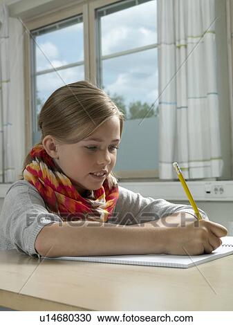 Girl in a classroom View Large Photo Image Stock Image - Girl in a classroom. Fotosearch