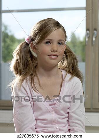 Stock Photography - Girl in classroom. Fotosearch
