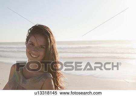 Stock Photography - Girl in front of sea. Fotosearch
