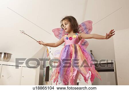 Girl in pink dress with fairy wings View Large Photo Image Picture - Girl in pink dress with fairy wings. Fotosearch