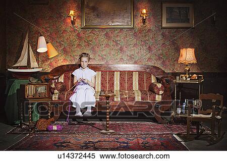 Stock Photography - Girl in rollers knitting. Fotosearch
