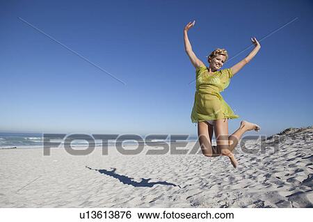 Stock Photograph - Girl jumping. Fotosearch