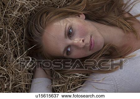 Girl laying grass View Large Photo Image Stock Photo - Girl laying grass. Fotosearch