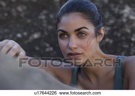 Girl leaning against stone View Large Photo Image Stock Photograph - Girl leaning against stone. Fotosearch
