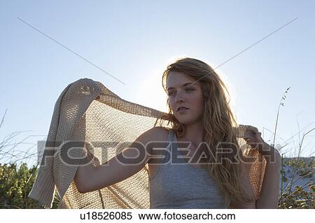 Girl lifting jacket View Large Photo Image Stock Photography - Girl lifting jacket. Fotosearch
