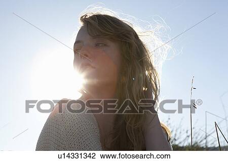 Stock Image - Girl looking to side. Fotosearch