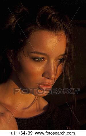 Stock Photo - Girl looking to the side. Fotosearch