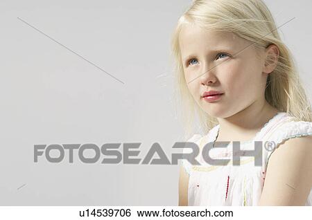 Stock Photograph - girl looking up. Fotosearch