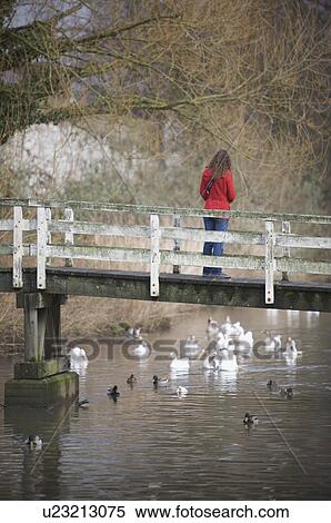 Girl on a bridge View Large Photo Image Stock Photography - Girl on a bridge. Fotosearch