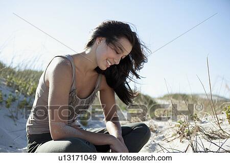Girl playing with sand View Large Photo Image Stock Photo - Girl playing with sand. Fotosearch