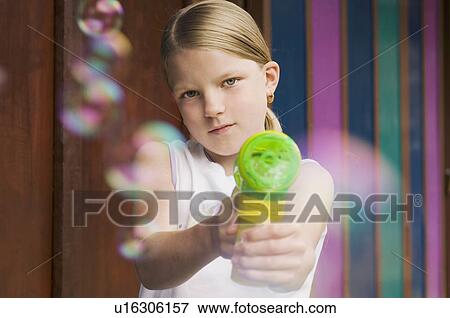 girl pointing bubble gun to camera View Large Photo Image Stock Photo - girl pointing bubble gun to camera. Fotosearch