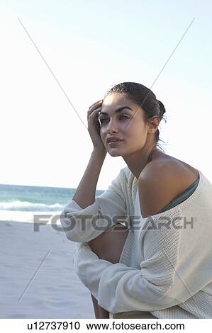 Girl sitting on beach View Large Photo Image Stock Image - Girl sitting on beach. Fotosearch