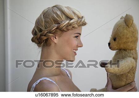 Girl smiling at her Teddy View Large Photo Image Stock Photography - Girl smiling at her Teddy. Fotosearch