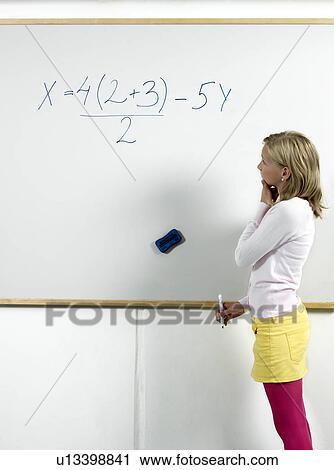 Girl standing by whiteboard View Large Photo Image Stock Image - Girl standing by whiteboard. Fotosearch