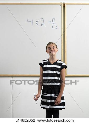 Girl standing by whiteboard View Large Photo Image Stock Image - Girl standing by whiteboard. Fotosearch