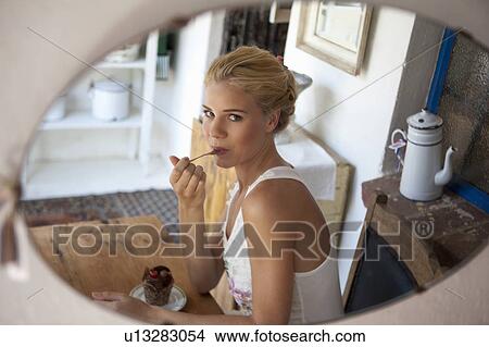 Girl tasting cake View Large Photo Image Picture - Girl tasting cake. Fotosearch