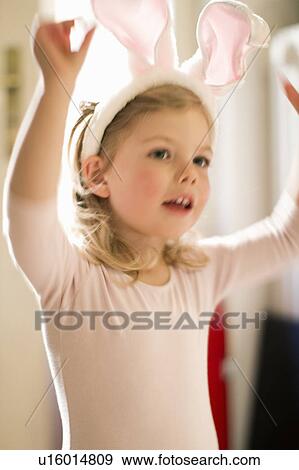 Girl wearing bunny ears View Large Photo Image Stock Photo - Girl wearing bunny ears. Fotosearch