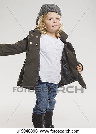 Girl wearing coat and rainboots View Large Photo Image Stock Image - Girl wearing coat and rainboots. Fotosearch