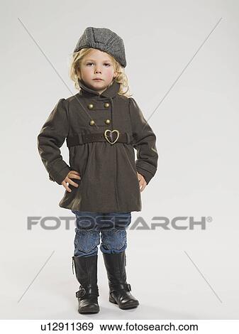 Girl wearing coat and rainboots View Large Photo Image Stock Photo - Girl wearing coat and rainboots. Fotosearch