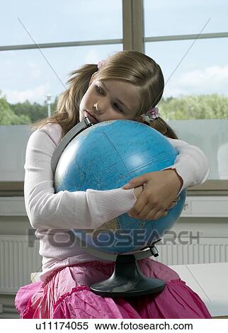 Stock Photography - Girl with earth globe. Fotosearch