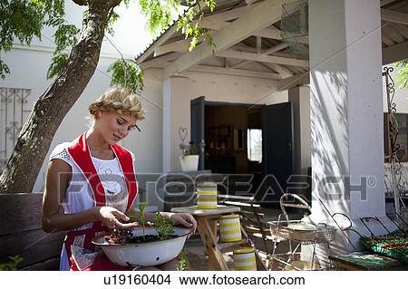 Picture - Girl with herbs. Fotosearch