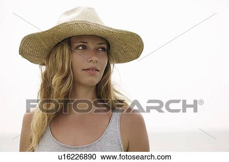 Stock Image - Girl with straw hat. Fotosearch