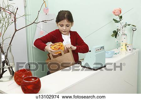 girl working behind shop till View Large Photo Image Picture - girl working behind shop till. Fotosearch